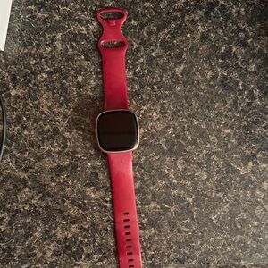 Fitbit versa 4 with purple band